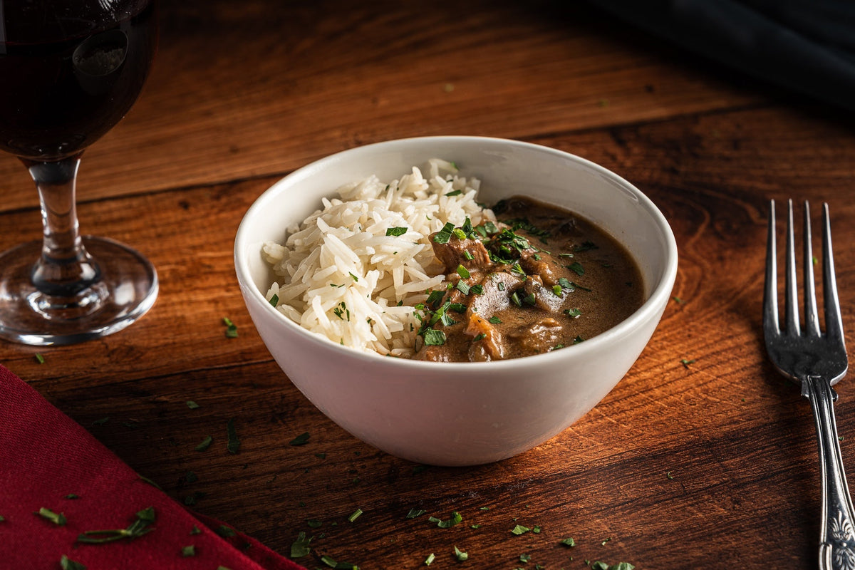 Our Beef Stroganoff features tender braising steak and mushrooms in a rich, creamy soured cream sauce, delicately seasoned with garlic, mustard and black pepper. Served with fluffy basmati rice, it's a comforting classic that's freshly prepared and cooked here in Torquay.