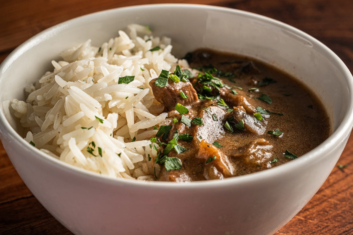 Our Beef Stroganoff features tender braising steak and mushrooms in a rich, creamy soured cream sauce, delicately seasoned with garlic, mustard and black pepper. Served with fluffy basmati rice, it's a comforting classic that's freshly prepared and cooked here in Torquay.